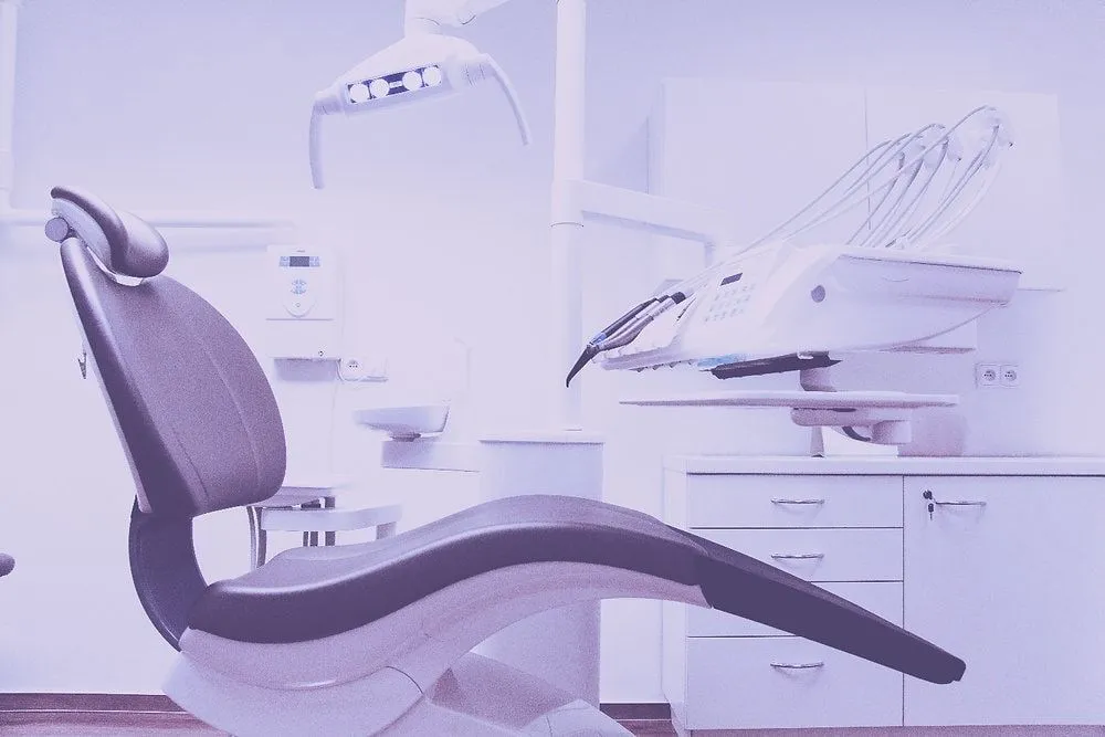 Healthcare provider reviewing HIPAA compliance documentation with a patient in a clinical setting